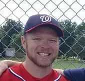 A baseball player smiling for the camera.